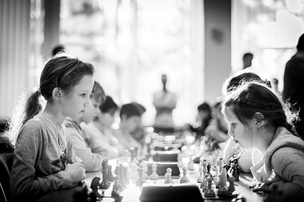 Two girls playing chess